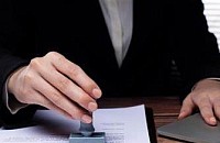 NC Notary Solutions stamping a document